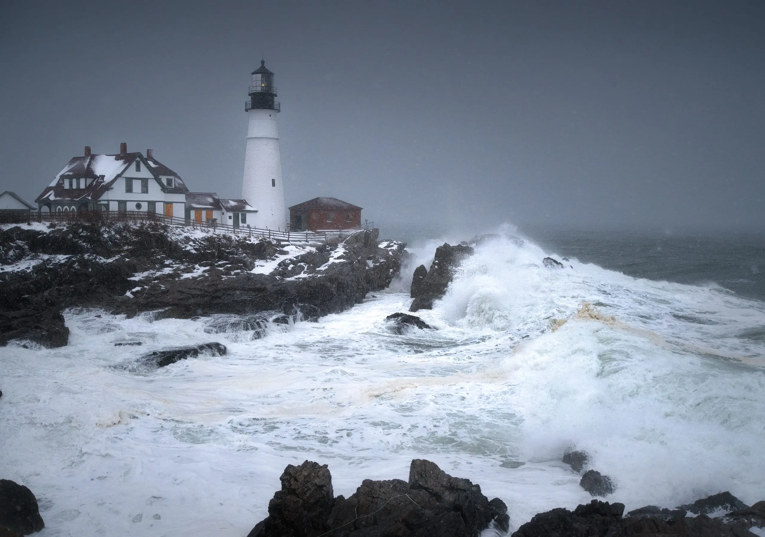 Portland Head Light above breaking surf in a winter storm